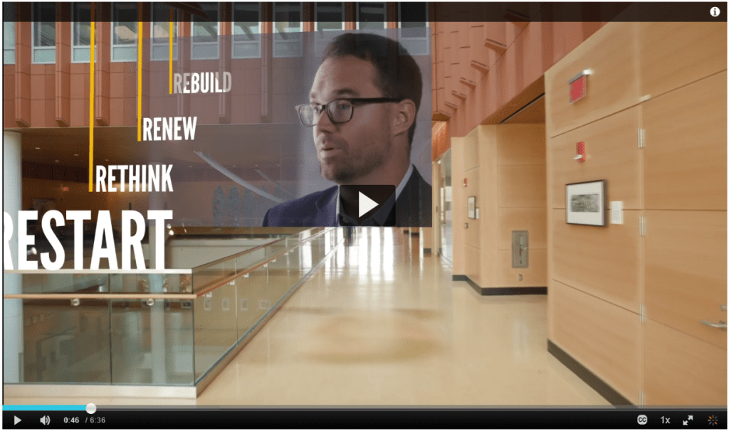 Video floating an image of instructor Brian Flannagan over an interior scene in the University of Michigan Ross Business School as his main points scroll into the distance.